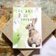 This simple, sweet card features little drawings of bunnies, and the words You Are So Loved.